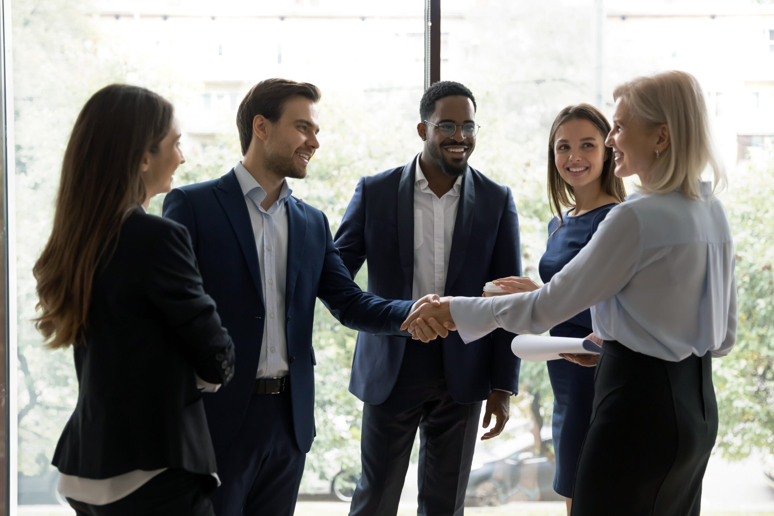 Group of Bachelor of Science in Business Administration professionals greeting each other in a circle